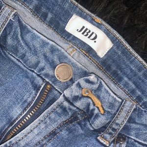 Distressed blue jeans